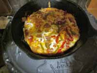 Pizza in a cast iron skillet cooked inside the stove yummy!